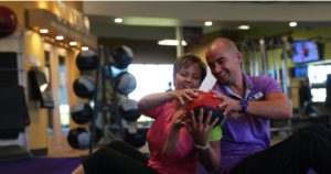 Gym coach and trainee